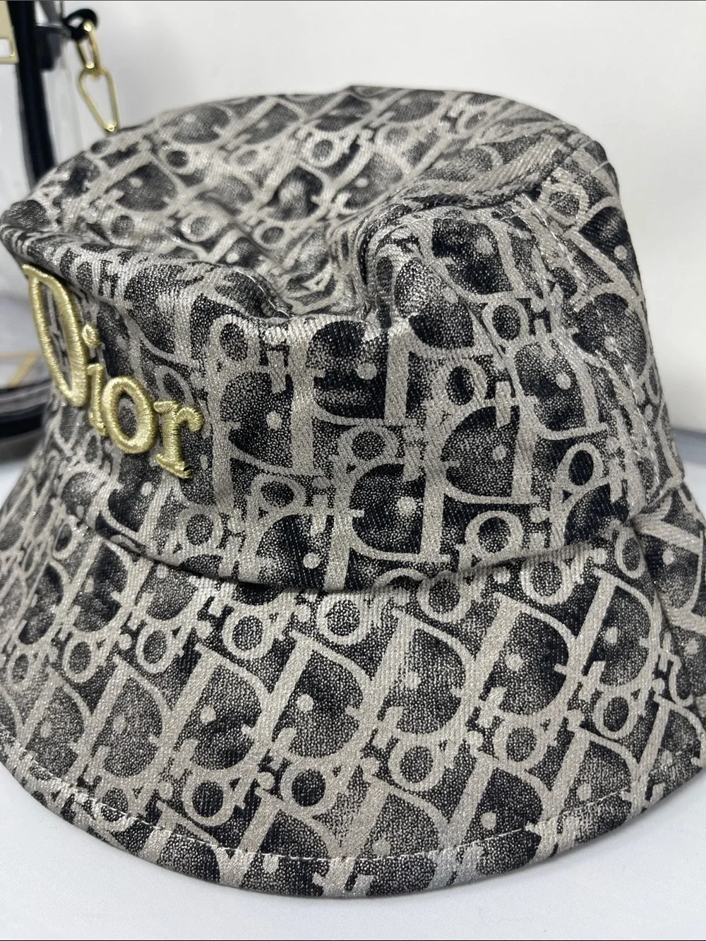 Fashion monogram bucket hat with gold and metallic gray accents & Clear bag